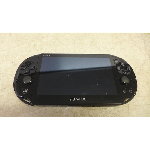 5118 - A Playstation Vita handheld games console and PS Vita travel case