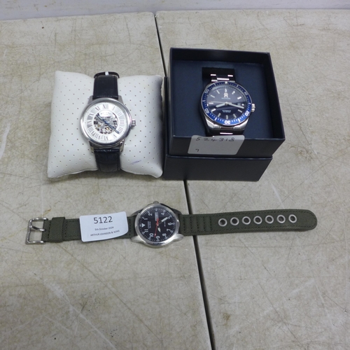 5122 - Three gentleman's wristwatches including a Rotary skeleton watch, an automatic Tommy Hilfiger Divers... 