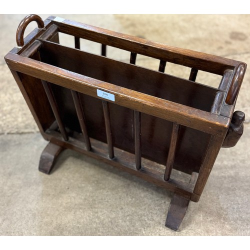 200 - An early 20th Century oak magazine rack and a pine tool chest