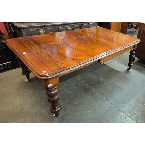 119 - A Victorian mahogany extending dining table