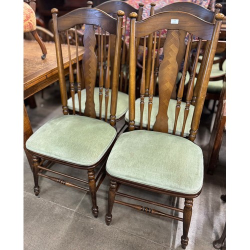 208 - A set of four American style beech and ash and fabric upholstered spindle back dining chairs