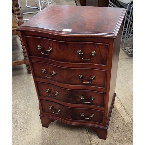 133 - A George III style mahogany serpentine chest of drawers