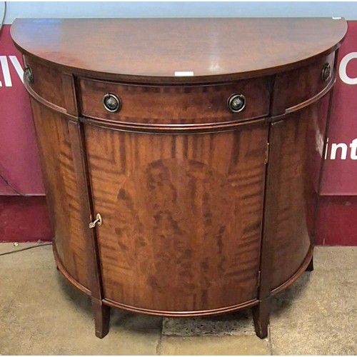 134 - A Regency style mahogany demi-lune side cabinet