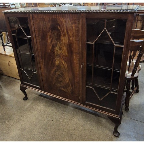 137 - An Edward VII mahogany three door bookcase, by Ray & Miles of Liverpool