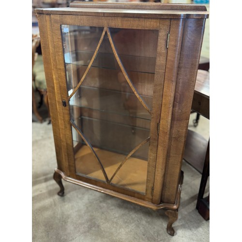 221 - An early 20th Century walnut display cabinet