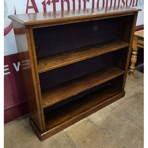 141 - An Edward VII oak open bookcase