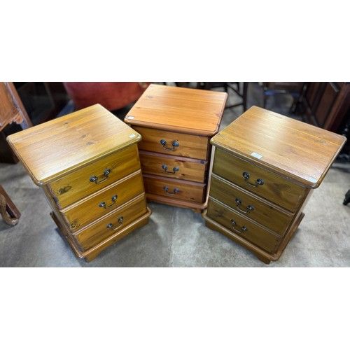 222 - Three pine bedside chests of drawers