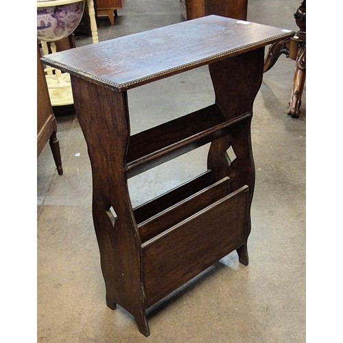 147 - An early 20th Century oak newspaper stand