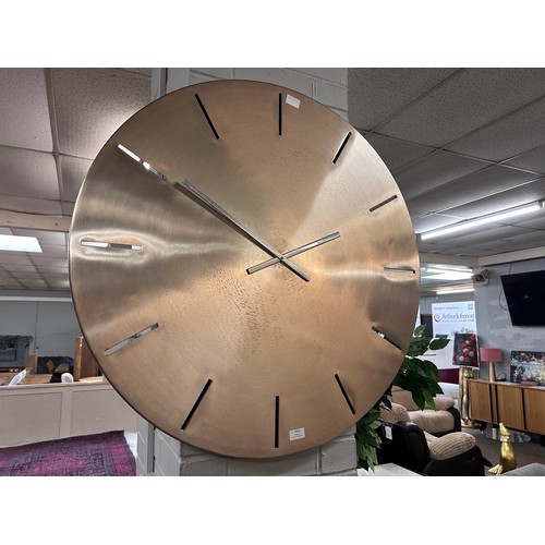 3062 - A large brushed steel minimalist clock