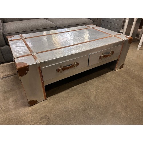 3064 - A large four drawer Aviation style coffee table