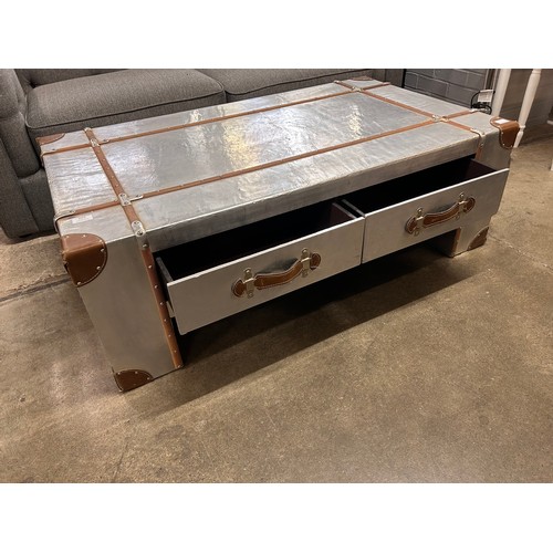 3064 - A large four drawer Aviation style coffee table