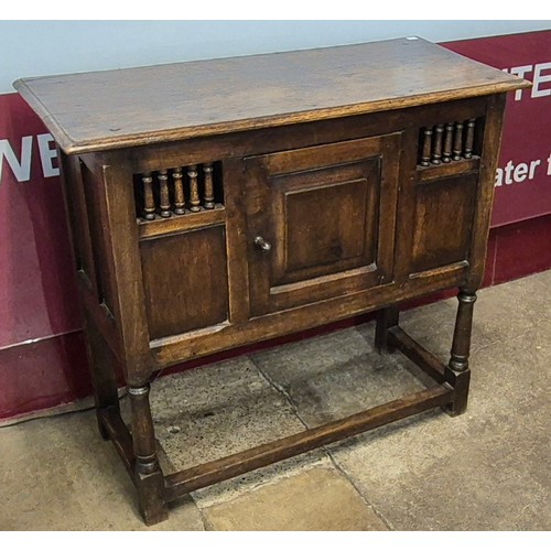 152A - A 17th Century style joined oak livery cupboard