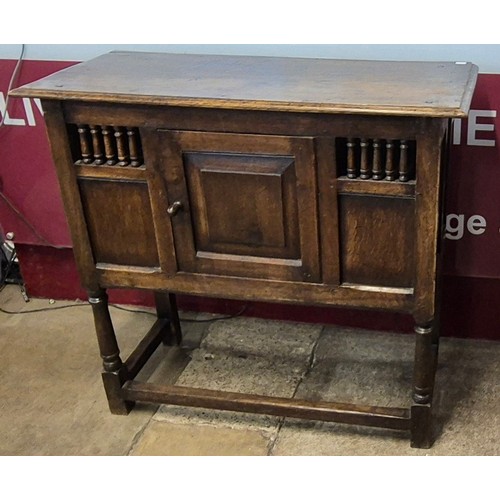 152A - A 17th Century style joined oak livery cupboard