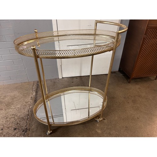 3070 - A gold mirrored drinks trolley