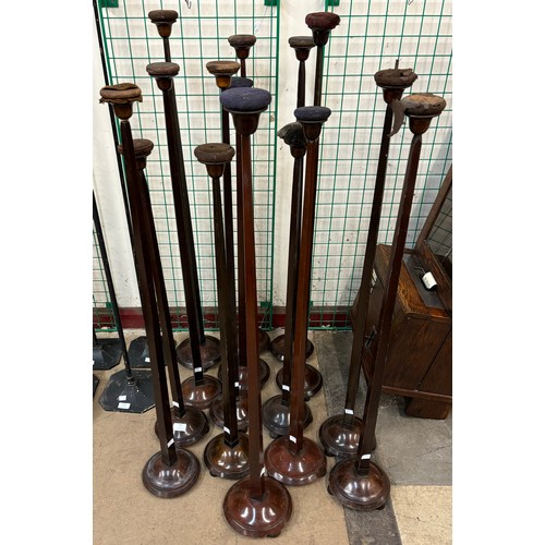 311 - Fifteen early 20th Century walnut & beech hat stands