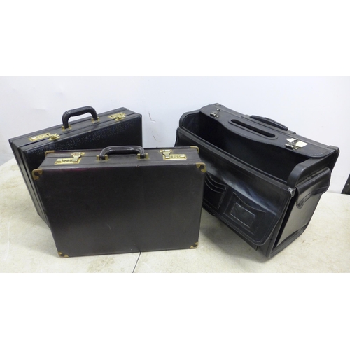 5301 - A pilots leather flight case with combination locks (122) and two leather brief cases