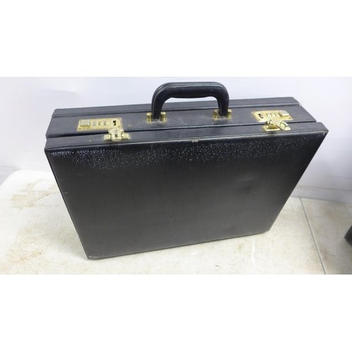 5301 - A pilots leather flight case with combination locks (122) and two leather brief cases