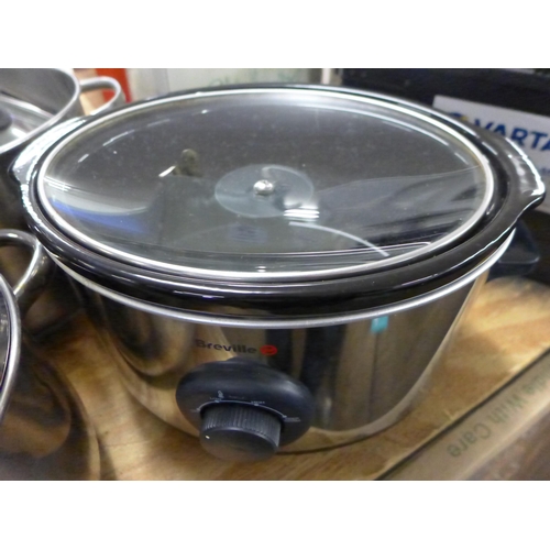 5312 - A large quantity of steel pots and lids and two slow cookers including Breville and Loyola