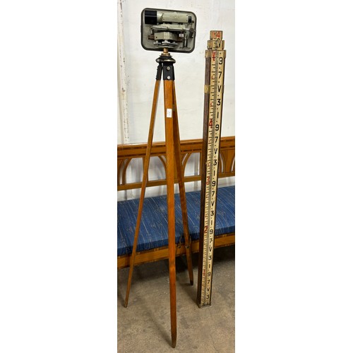 315 - A Cooke, Troughton and & Simms Ltd. theodolite on tripod stand and an early 20th Century measuring s... 