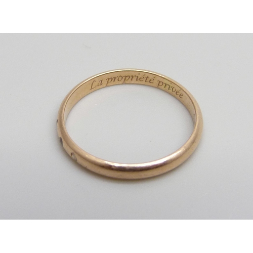 1000 - A 14ct gold ring set with three white stones, inscription inside shank, 1.5g, L