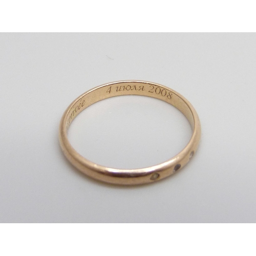 1000 - A 14ct gold ring set with three white stones, inscription inside shank, 1.5g, L