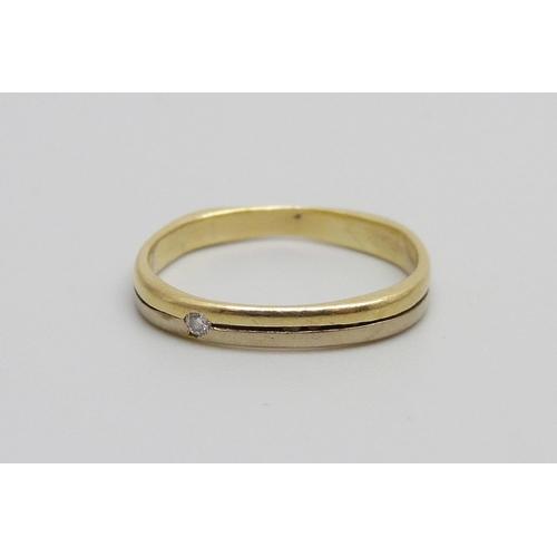 1001 - An 18ct gold ring marked 750, set with a diamond, 1.7g, J