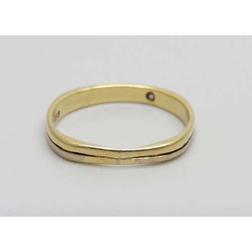 1001 - An 18ct gold ring marked 750, set with a diamond, 1.7g, J