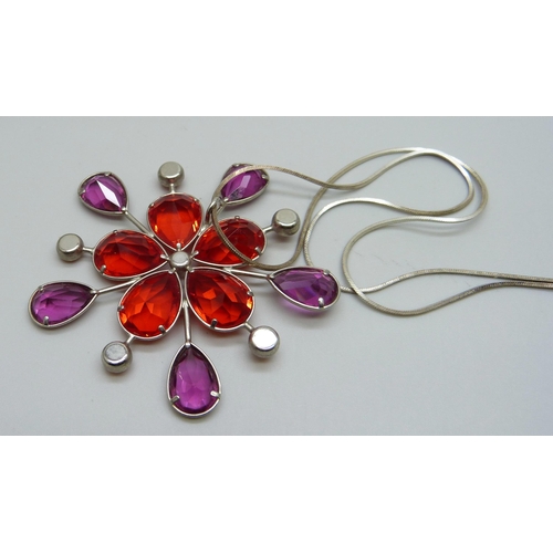 1006 - A Swarovski red crystal pendant on a silver chain, 6cm