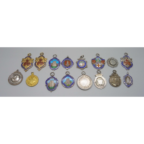 1039 - A collection of 12 silver and enamel football fobs, 121g, together with four others