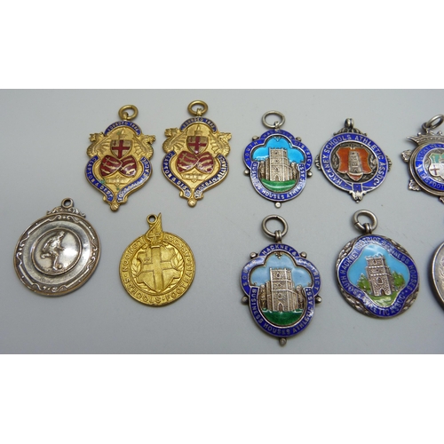 1039 - A collection of 12 silver and enamel football fobs, 121g, together with four others