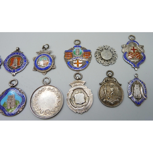 1039 - A collection of 12 silver and enamel football fobs, 121g, together with four others