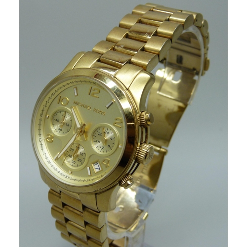 1042 - A Michael Kors gold tone chronograph wristwatch, 40mm case including crown