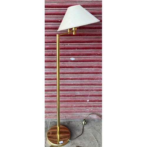 244 - An articulated brass standard lamp