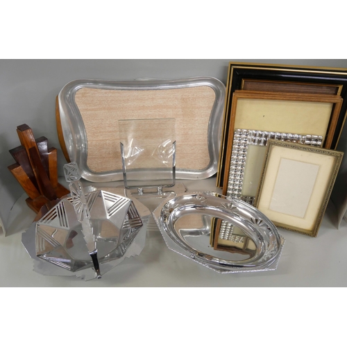 1063 - Two 1930s chrome dishes, a collection of picture frames, wooden book, tray, a catalogue for the sale... 