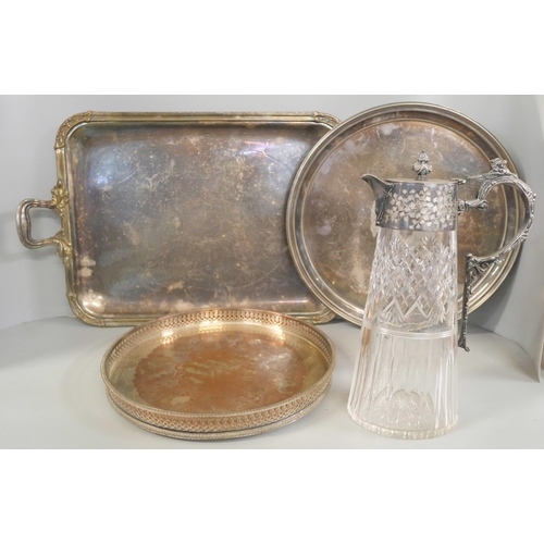 1065 - A silver plated gallery tray, two other plated trays and a plated claret  jug **PLEASE NOTE THIS LOT... 