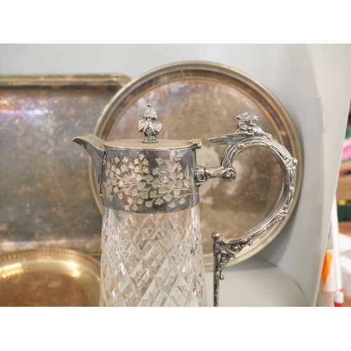 1065 - A silver plated gallery tray, two other plated trays and a plated claret  jug **PLEASE NOTE THIS LOT... 