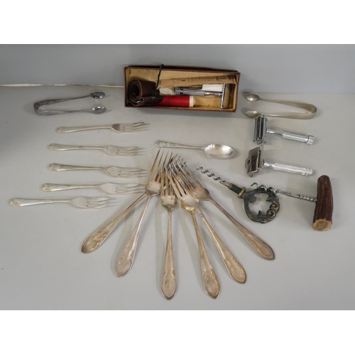 1074 - Two pairs of sugar spoons, a 1937 Coronation spoon, collection of forks, two corkscrews and razors