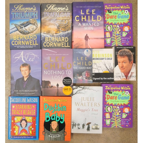 1078 - A collection of fourteen signed books including Lee Childs novels, Jacqueline Wilson and Bernard Cor... 