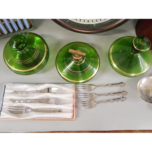 1087 - A collection of dessert forks, knifes and spoons, wooden clock, three green glass jars and metal jug... 