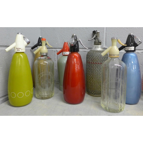 1091 - A collection of eight soda siphons **PLEASE NOTE THIS LOT IS NOT ELIGIBLE FOR IN-HOUSE POSTING AND P... 