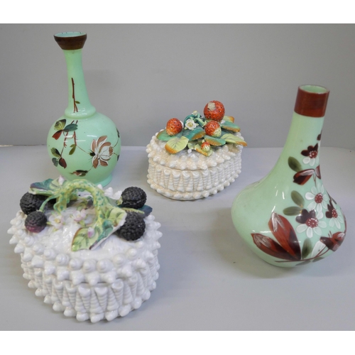 618 - Two ceramic baskets of fruit, both a/f and two opaline green glass vases