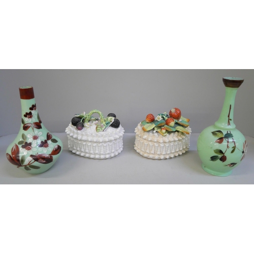 618 - Two ceramic baskets of fruit, both a/f and two opaline green glass vases