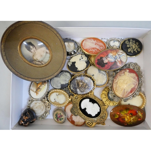 622 - A collection of ceramic floral brooches and other plaque brooches, cameos, etc. and a portrait minia... 