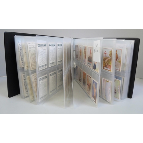 647 - An album with 14 sets of cigarette cards