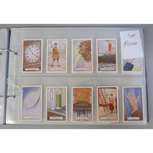 647 - An album with 14 sets of cigarette cards