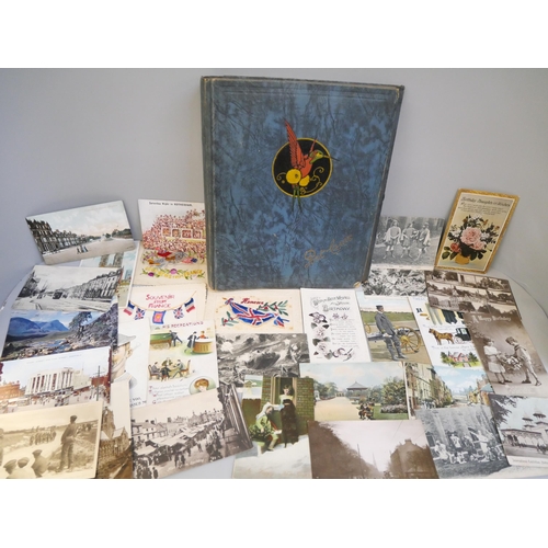 651 - A collection of WWI postcards and an empty postcard album