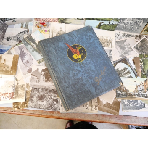 651 - A collection of WWI postcards and an empty postcard album