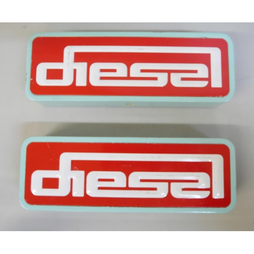 656 - A pair of Diesel (clothing) painted wooden shop display signs