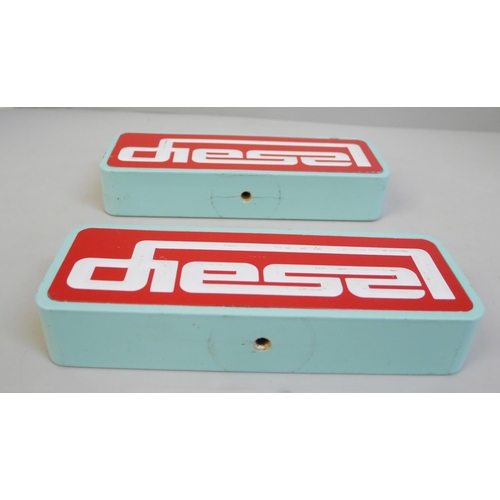 656 - A pair of Diesel (clothing) painted wooden shop display signs