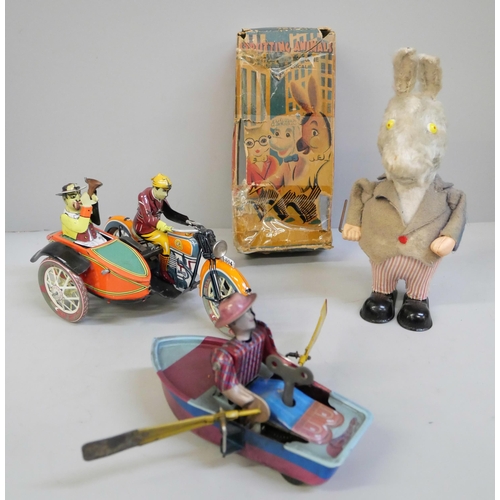 657 - A Strutting Animals clockwork donkey with twirling cane and moving ears, boxed, a tin plate motorcyc... 